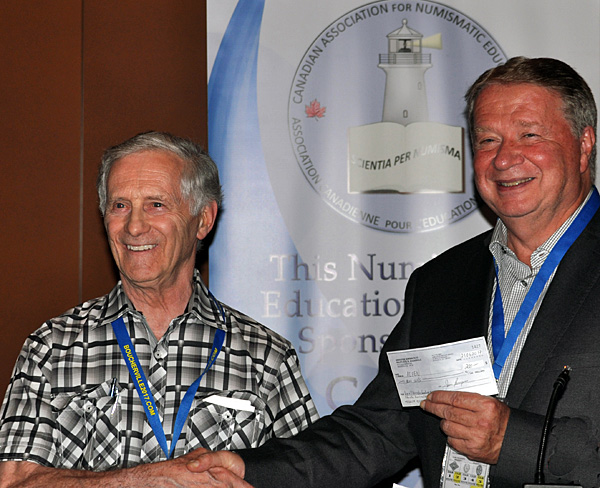 Pierre Leclerc presenting a donation to CAFNE